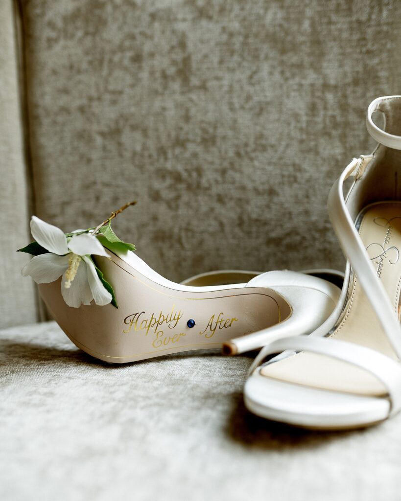 Utah elopement photographer captures bridal shoes with 'happily ever after' written on soles 