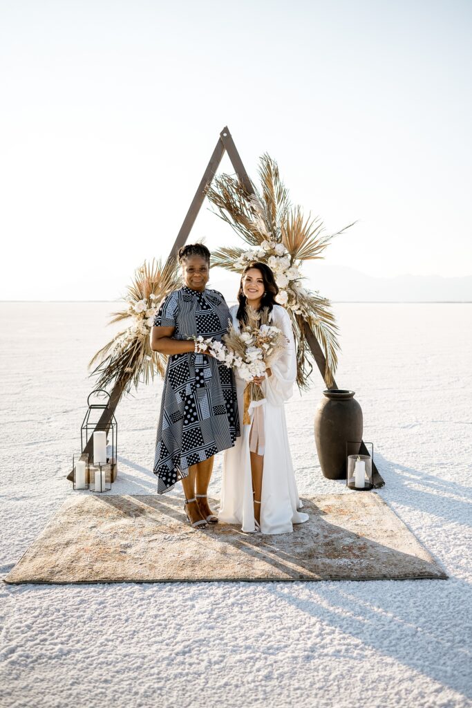 Utah elopement photographer captures bride standing with mother of groom