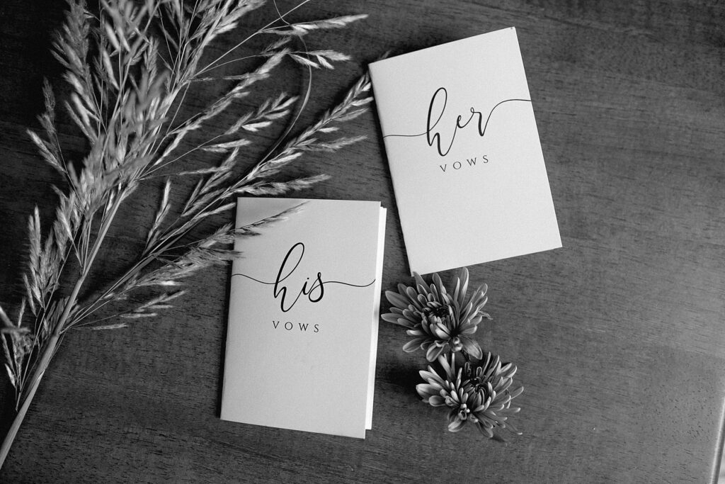 Utah elopement photographer captures black and white portrait of his and hers vow books