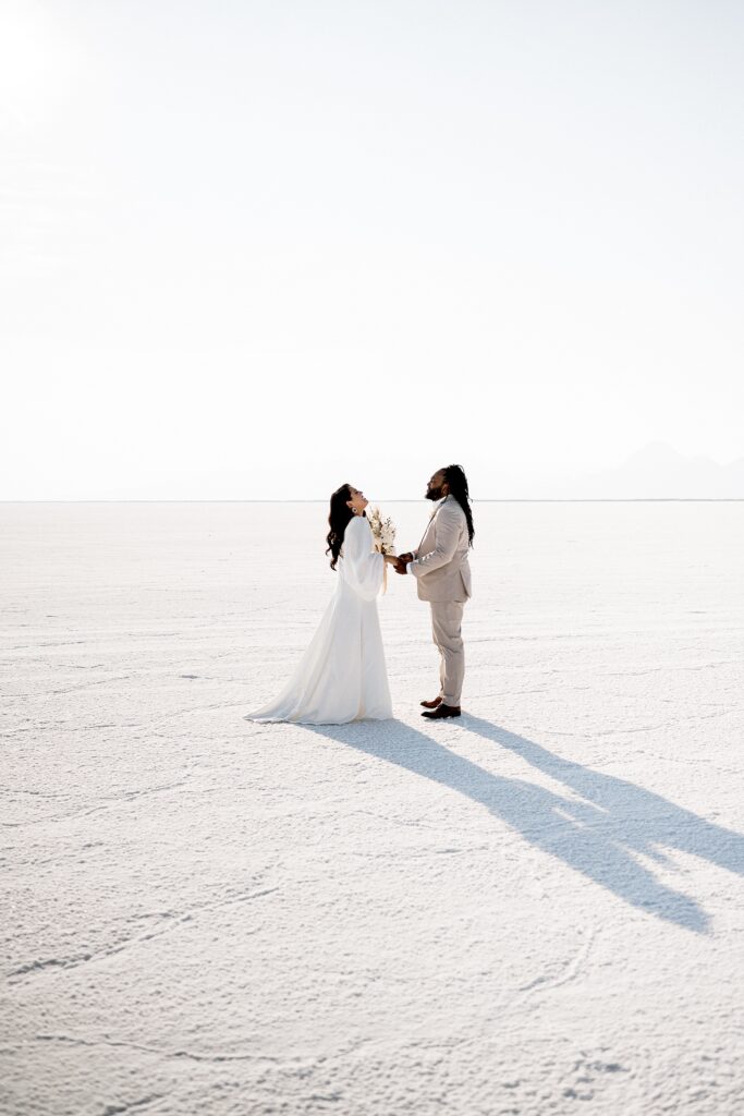 Utah elopement photographer captures first look between bride and groom before Salt Flats wedding