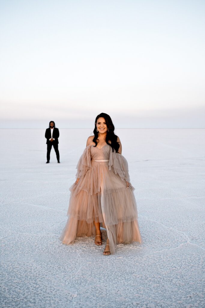 Utah elopement photographer captures bride wearing Salt Gowns gown during portraits
