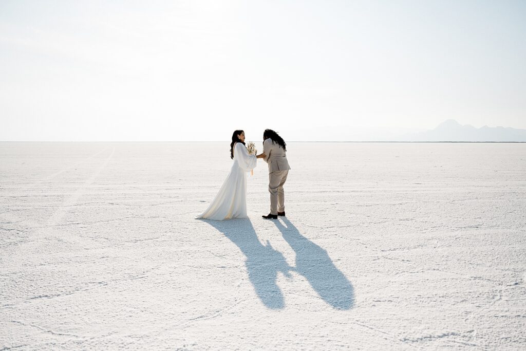 Utah elopement photographer captures bride and groom during first look before Salt Flats elopement