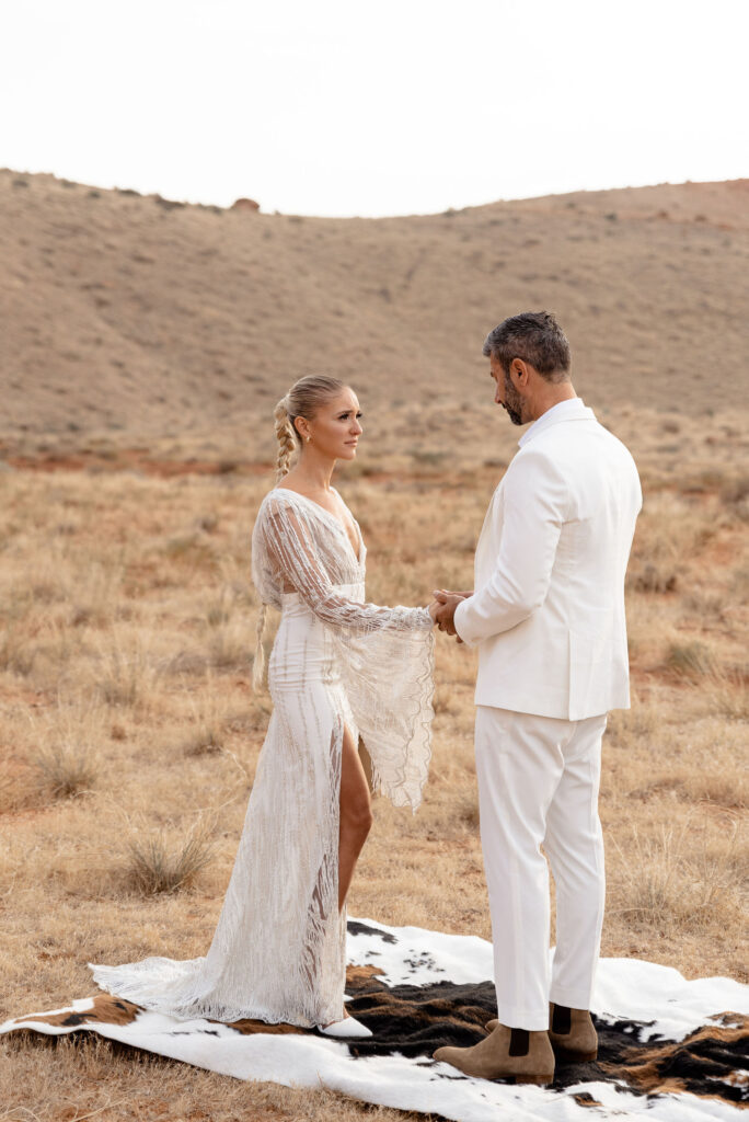 Utah elopement photographer captures groom reciting vows to his bride