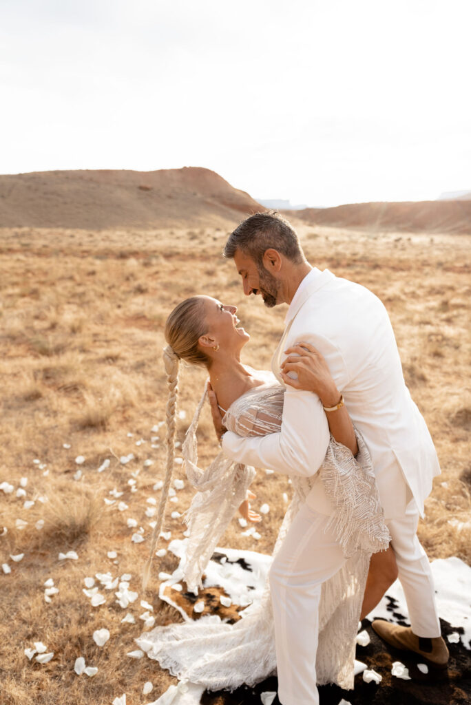 Utah elopement photographer captures groom dipping bride during bridal portraits
