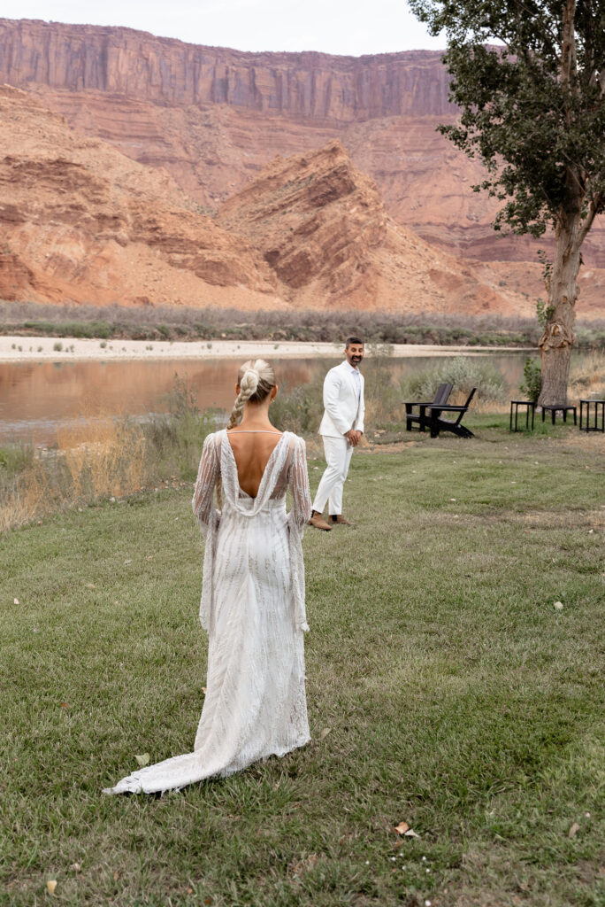 Moab elopement photographer captures first look between bride and groom before Moab elopement 