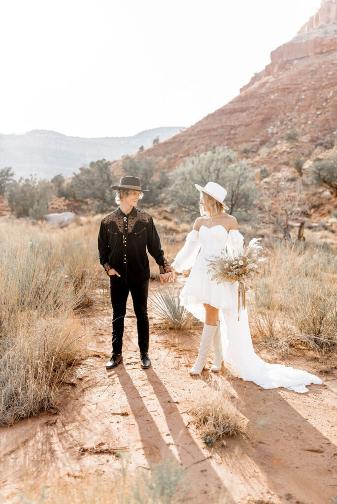 Utah elopement photographer captures couple holding hands after Kanab Utah elopement