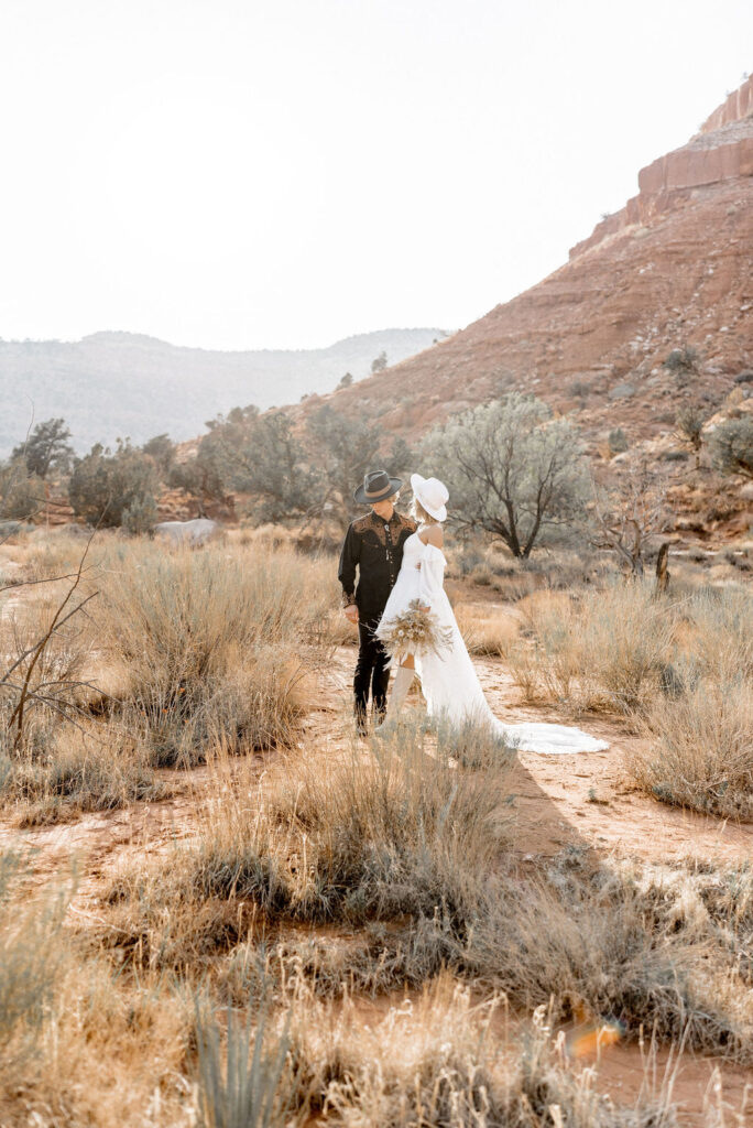 Utah elopement photographer captures couple standing together in Kanab Utah after elopement