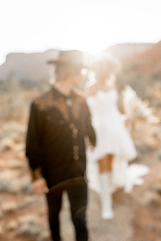 Utah elopement photographer captures couple walking together in Kanab