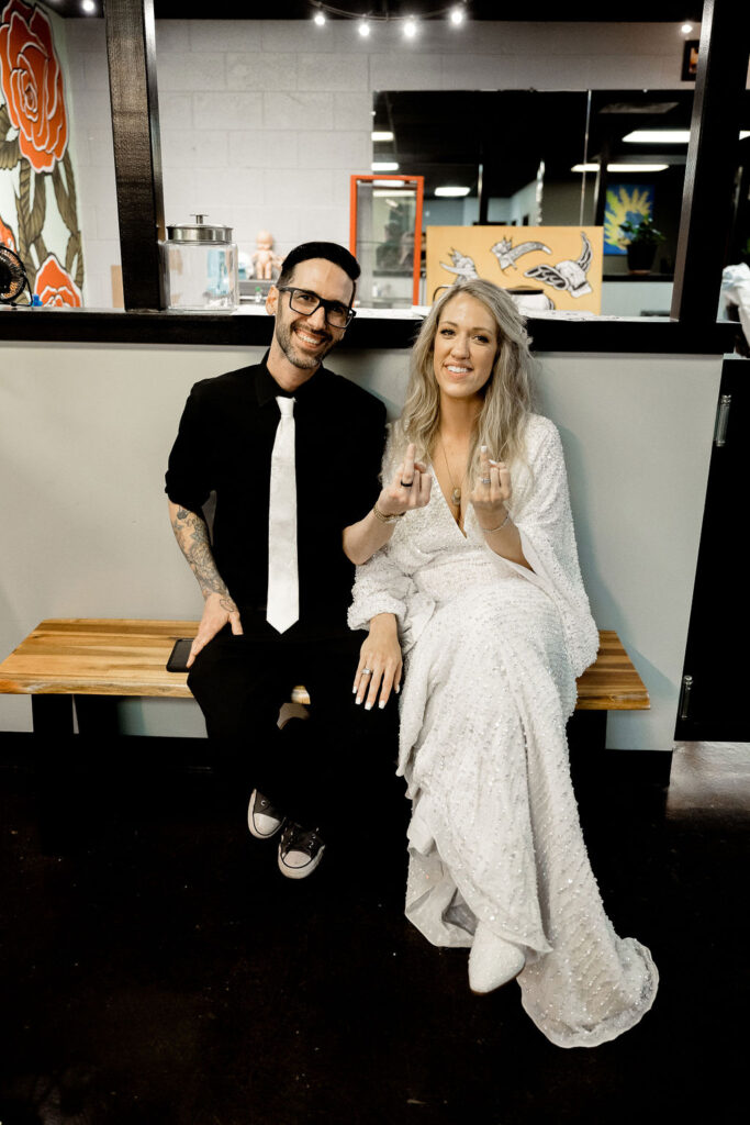 Utah elopement photographer captures couple at tattoo shop after wedding