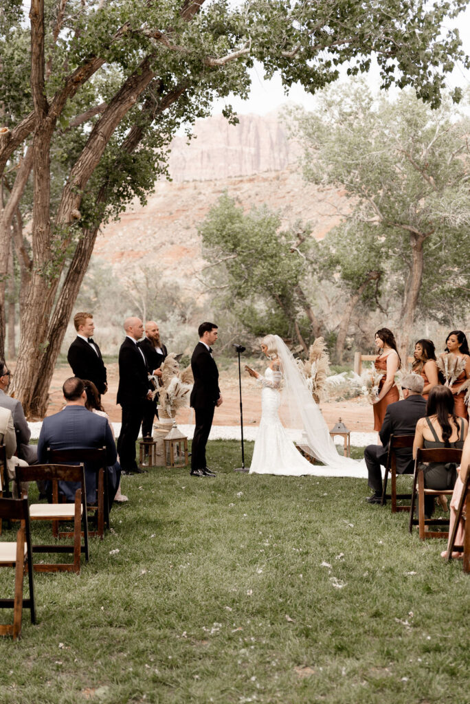 Utah elopement photographer captures bride and groom during Zion National Park wedding ceremony