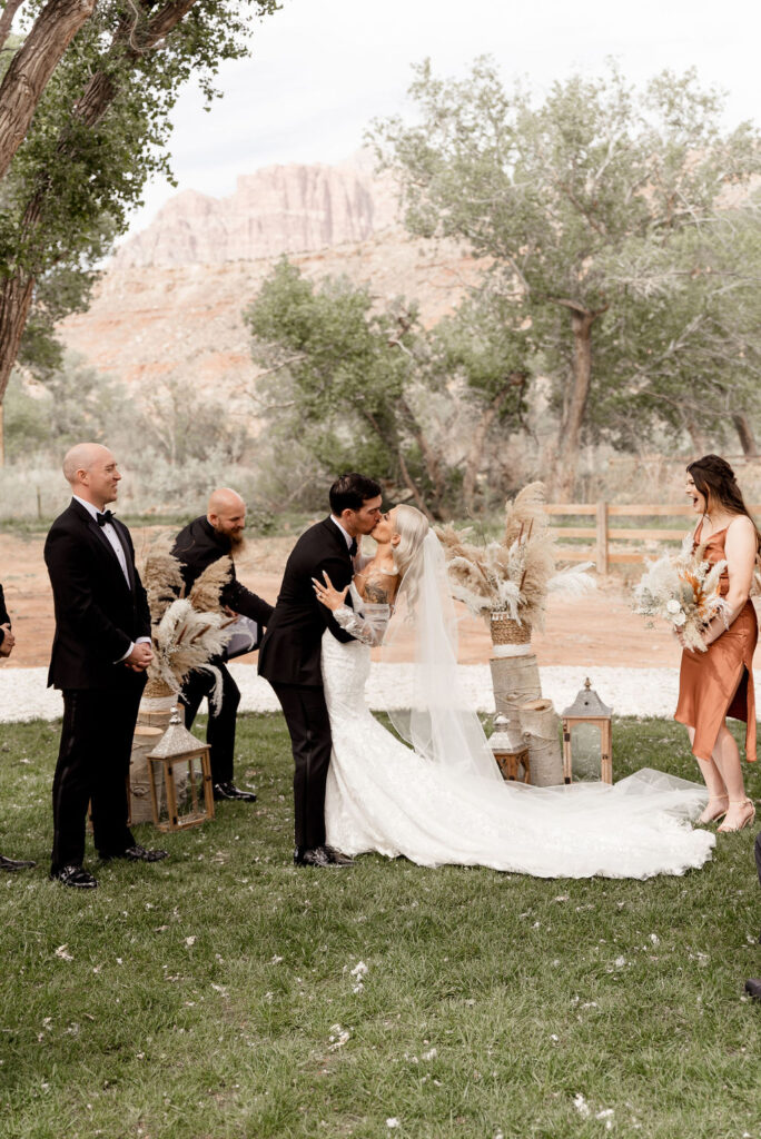 Utah elopement photographer captures bride and groom kissing after Zion National Park wedding ceremony