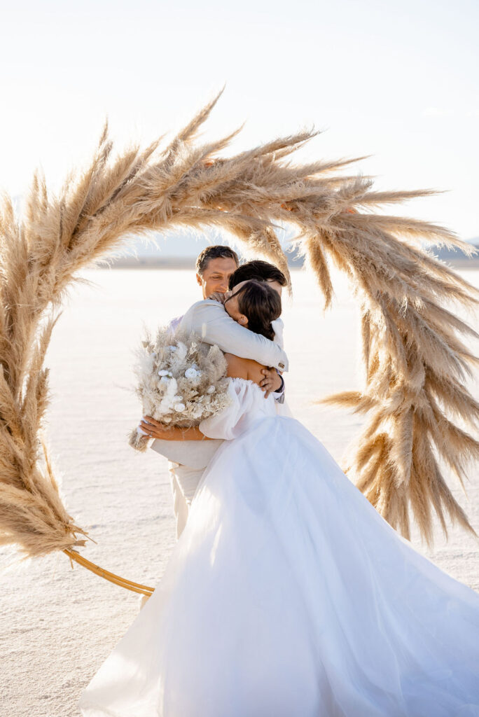 Utah elopement photographer captures couple hugging after wedding ceremony