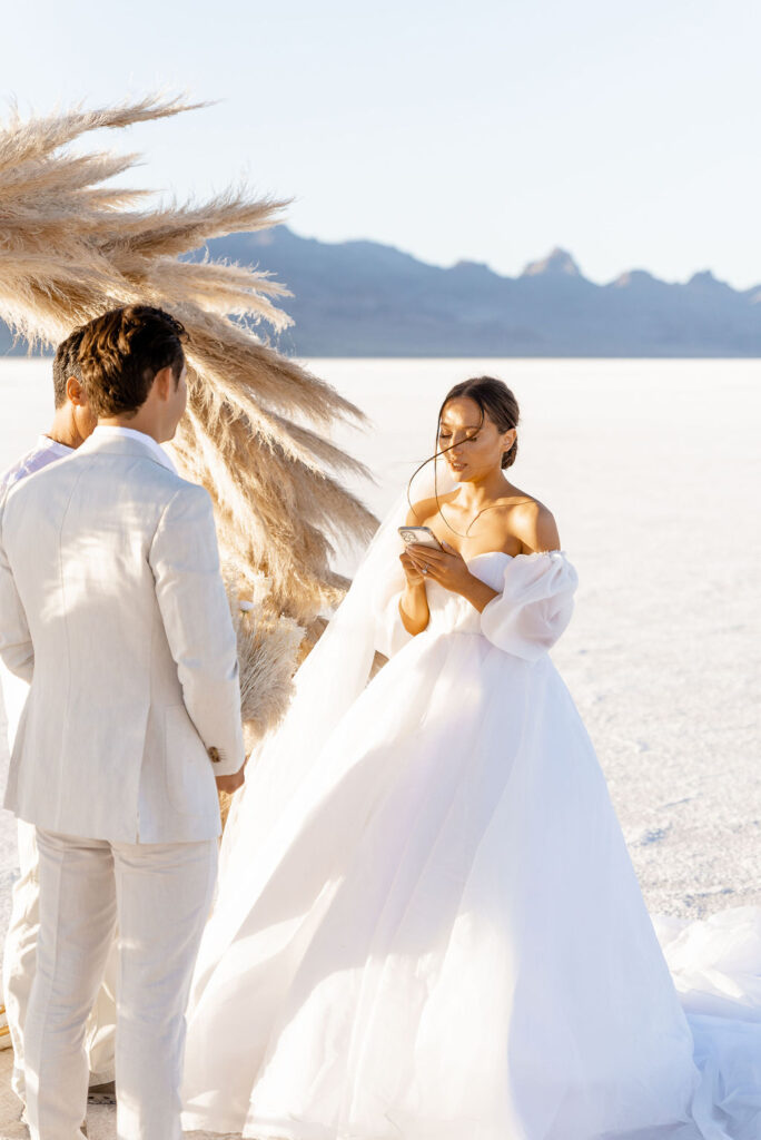 Utah elopement photographer captures bride reading vows during emotional vow reading