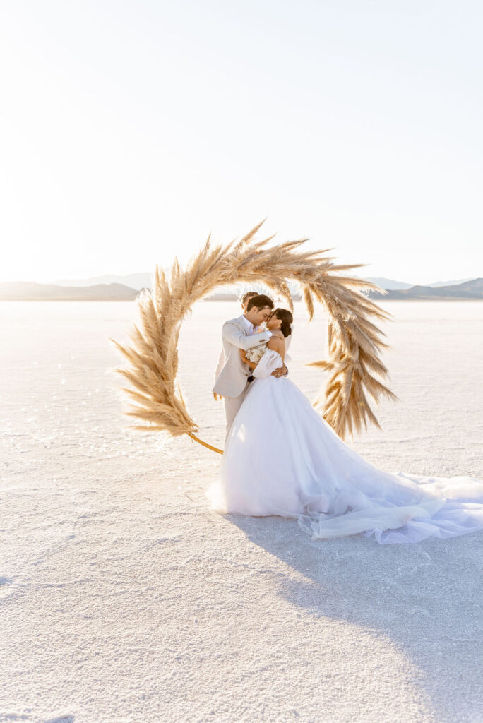 Utah elopement photographer captures bride and groom kissing after intimate wedding ceremony