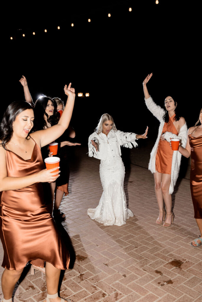 Utah elopement photographer captures bride dancing with bridesmaids