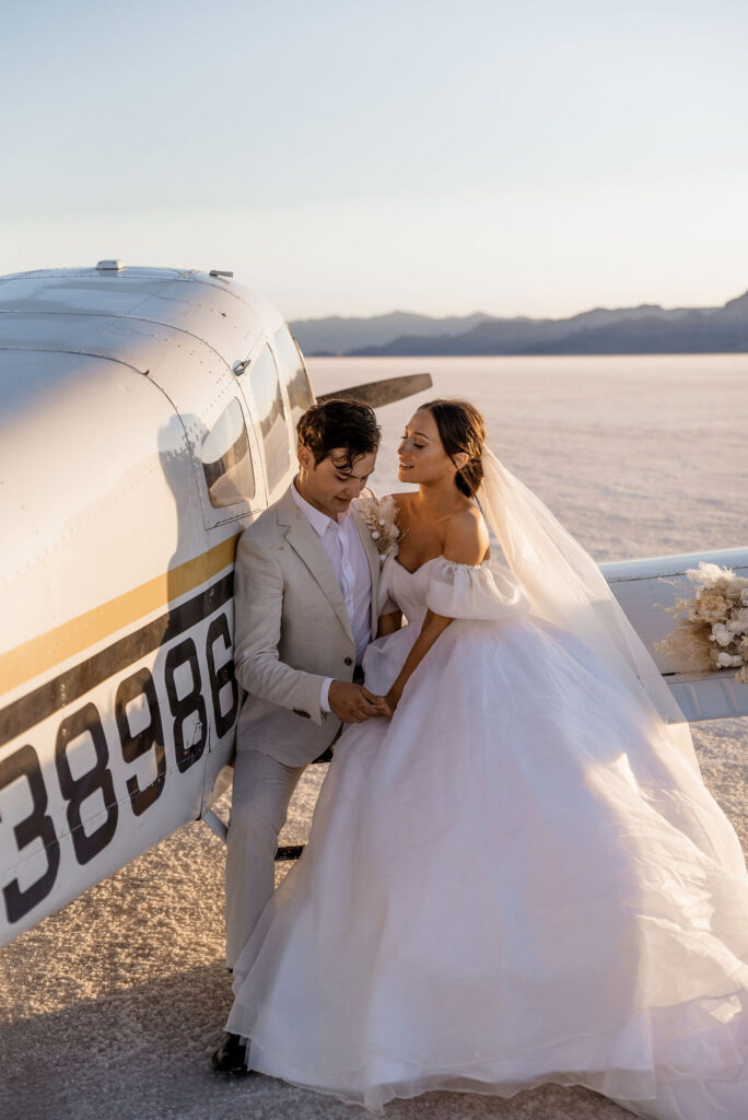 Utah elopement photographer captures couple celebrating recent marriage on airplane