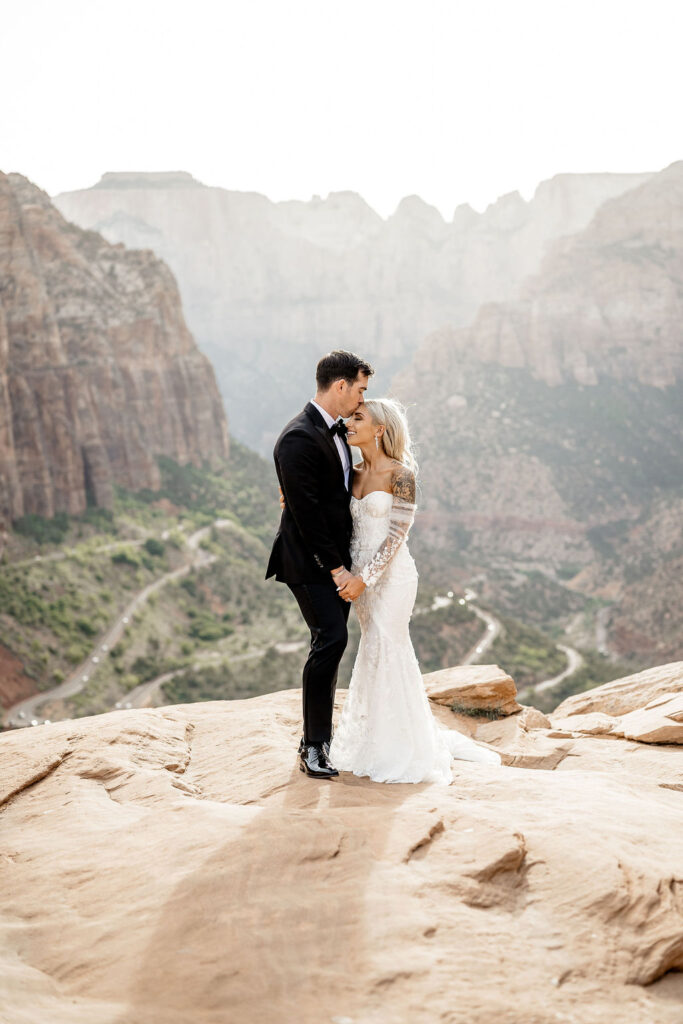 Utah elopement photographer captures bride and groom hugging during bridal portraits