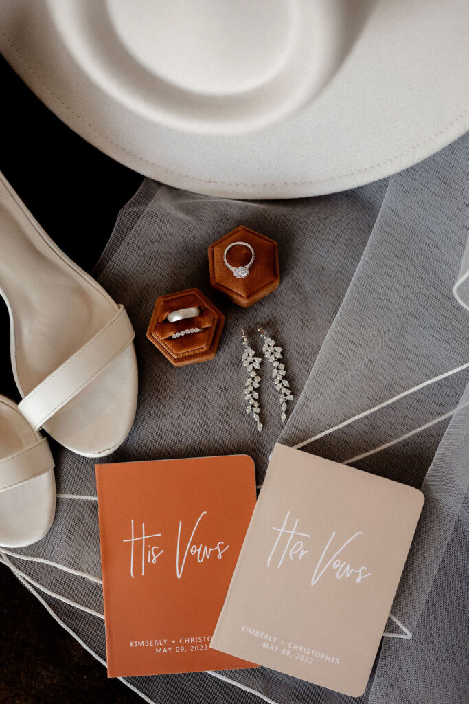 Utah elopement photographer captures his and hers vow books in rust and blush colors 