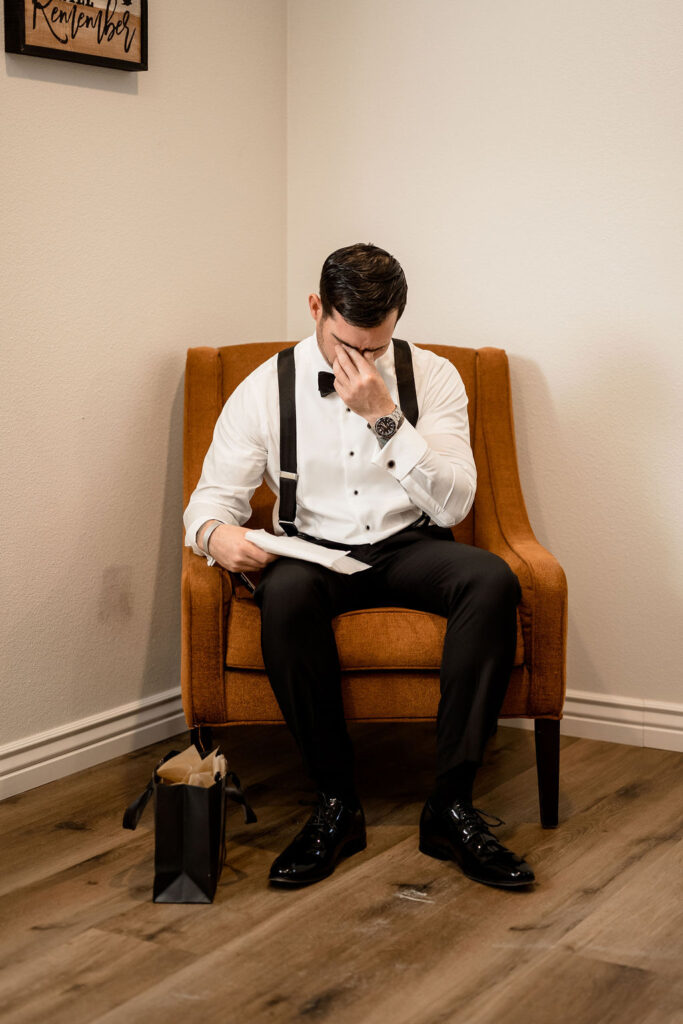 Utah elopement photographer captures groom getting emotional reading letter from bride