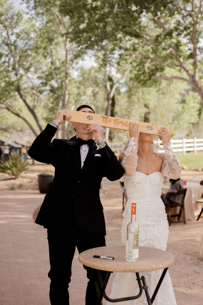 Utah elopement photographer captures bride and groom drinking