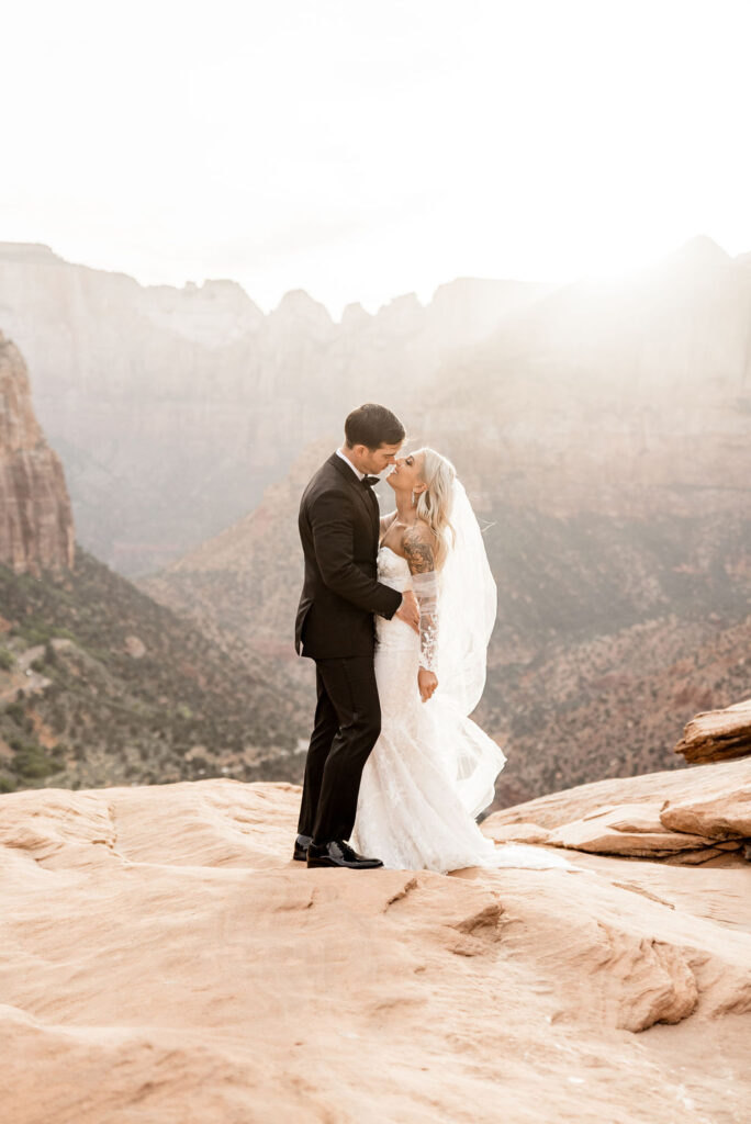 Utah elopement photographer captures bride and groom kissing during bridal portraits