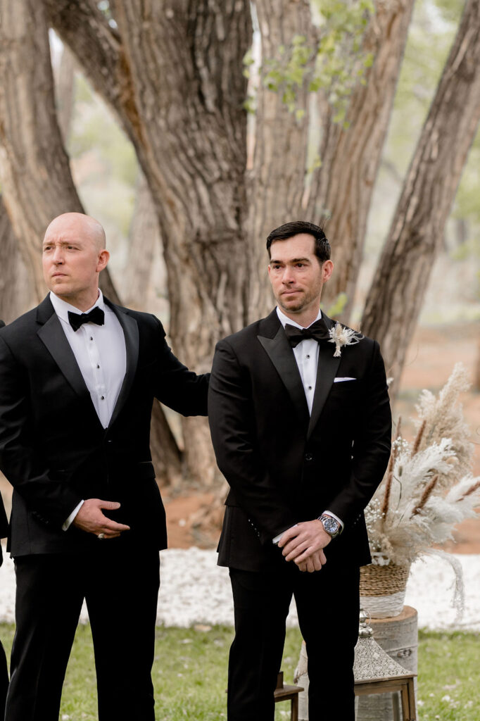 Utah elopement photographer captures groom seeing bride walk down aisle
