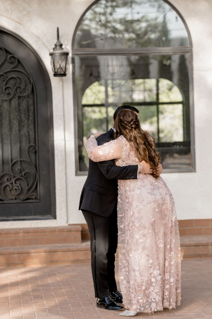 Utah elopement photographer captures groom hugging mother after mother son dance