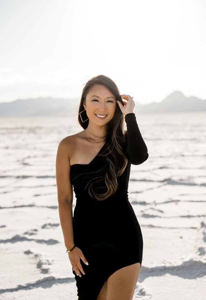 Utah elopement photographer captures woman wearing off shoulder black dress