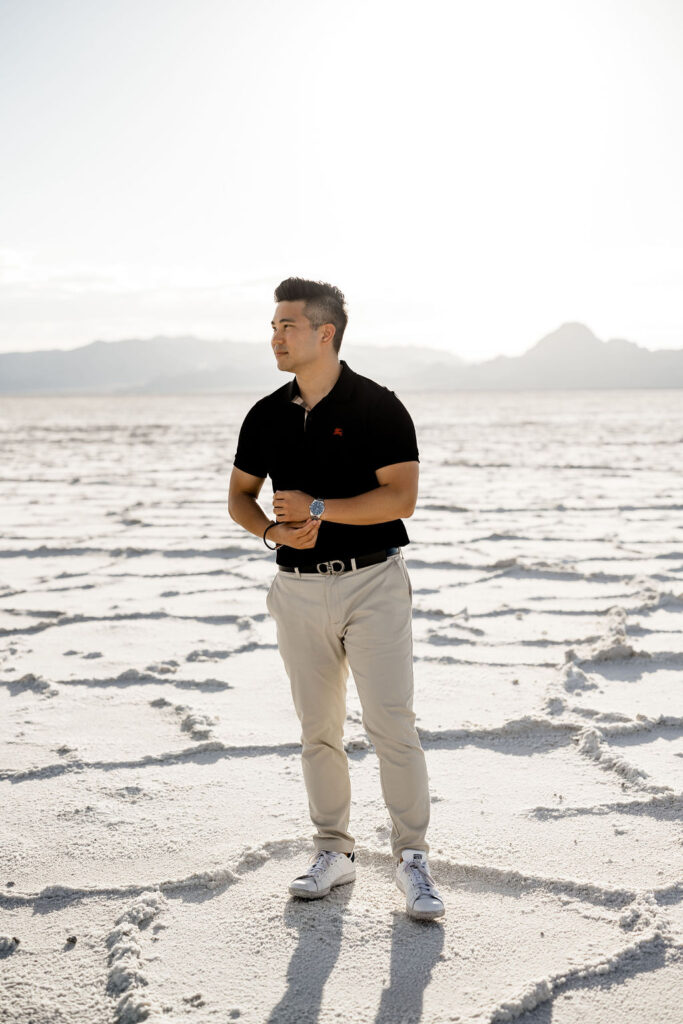 Utah elopement photographer captures man wearing khaki pants and black polo shirt