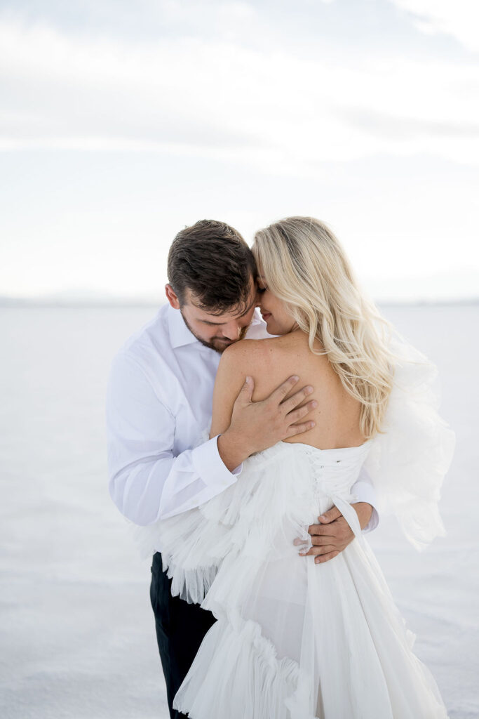 Utah elopement photographer captures couple embracing during outdoor engagements