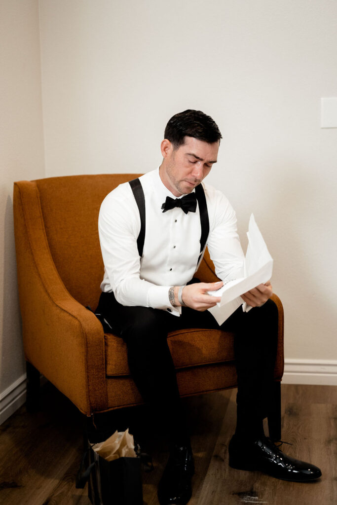 Utah elopement photographer captures groom reading letter from bride