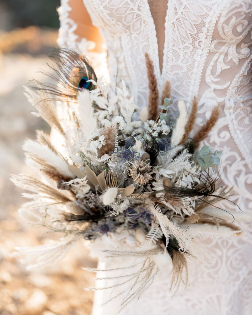 Big Sur elopement photographer captures bride holding pampas grass bridal bouquet