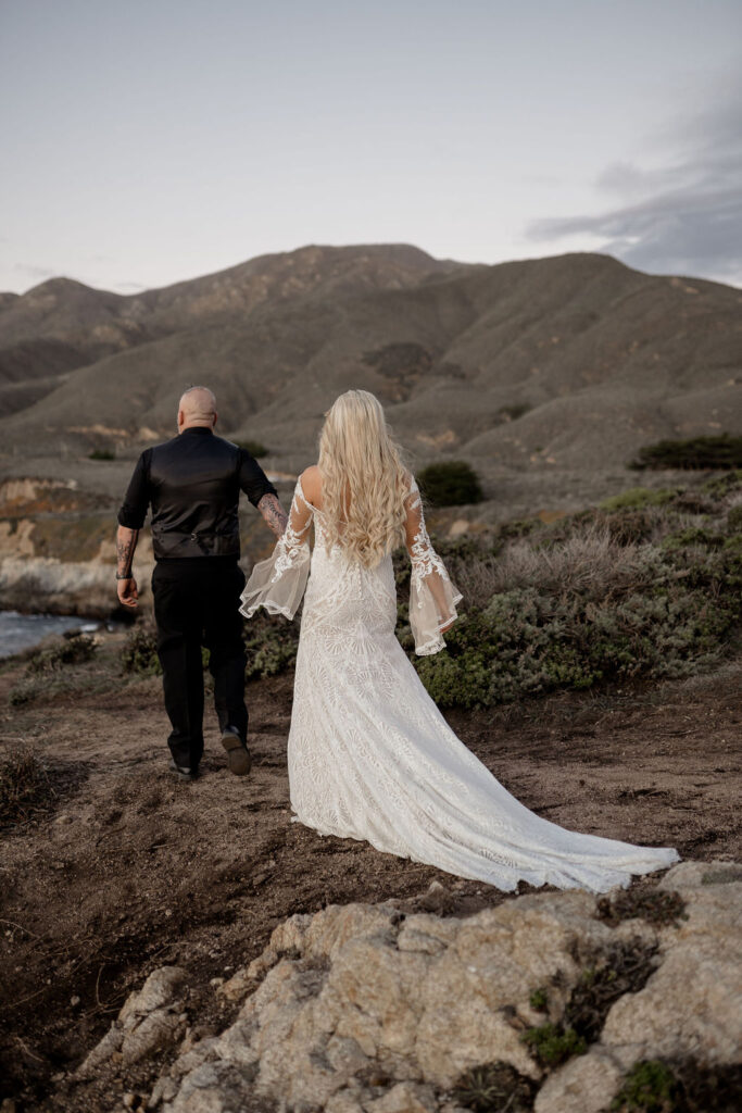 Big Sur elopement photographer captures couple walking away during portraits