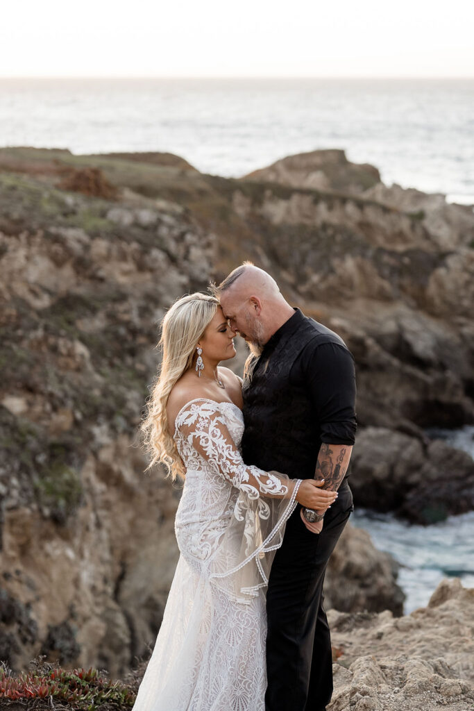 Big Sur elopement photographer captures couple forehead to forehead during portraits