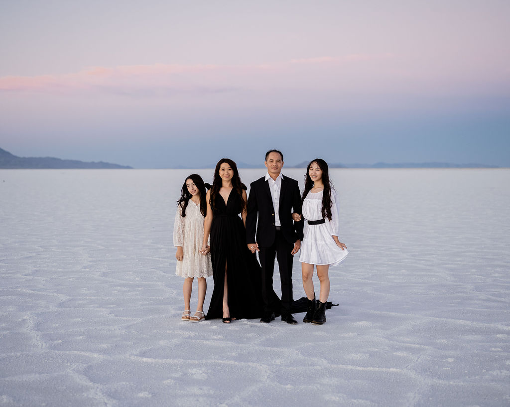 Family photos at the salt flats in dresses and suit at blue hour