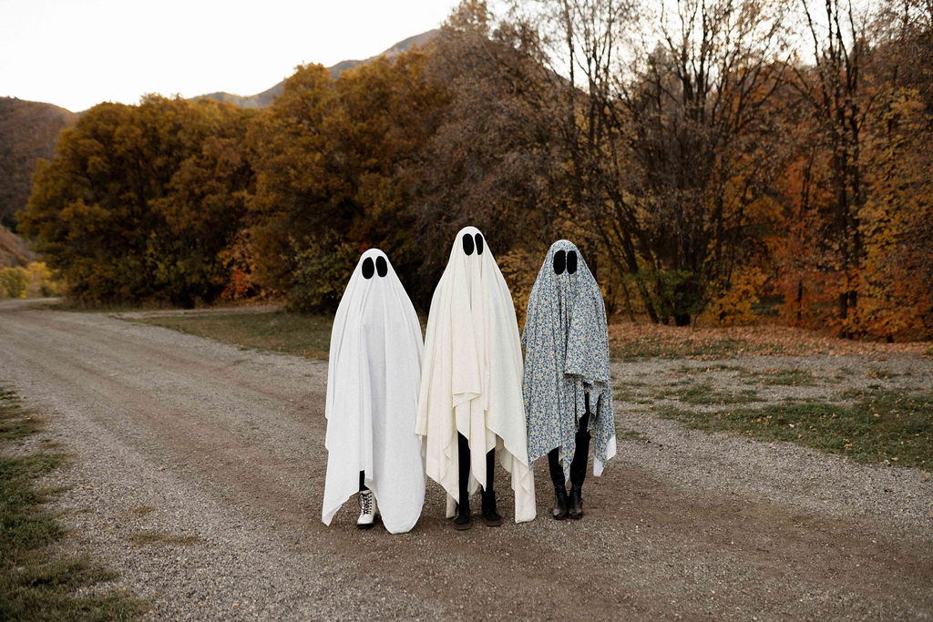 Halloween sheet ghost costumes during autumn photoshoot