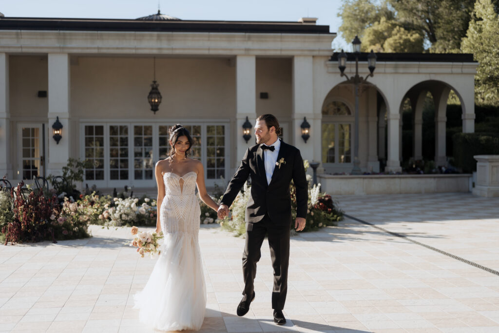 Becca Dahl captures this bride and groom at the UVU Museum smiling after their wedding ceremony.
