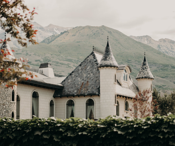 Wadley Farms castle surrounded by manicured grounds and mountain views in Utah Valley.