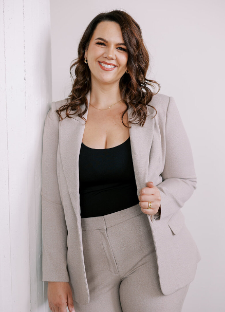 Braelynn, another one of the wedding planners Salt Lake City has to offer, is with with Belle Bodas and she smiles for a professional shot.
